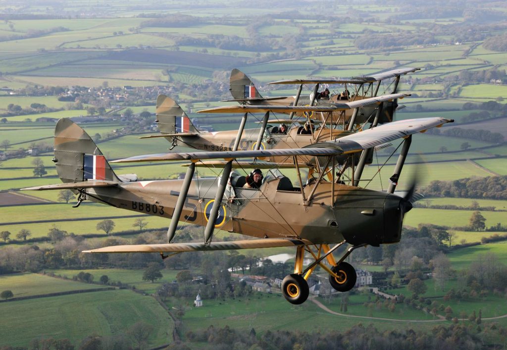 Ashes being scattered from a vintage wartime Tiger Moth