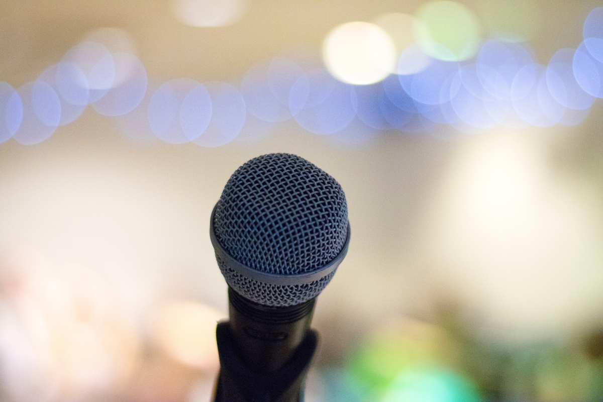 Eulogy examples: a microphone in front of a blurred background