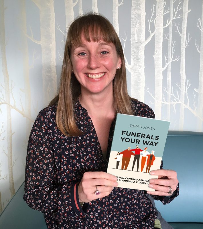 Sarah Jones from Full Circle Funerals holds her book, Funerals, Your Way